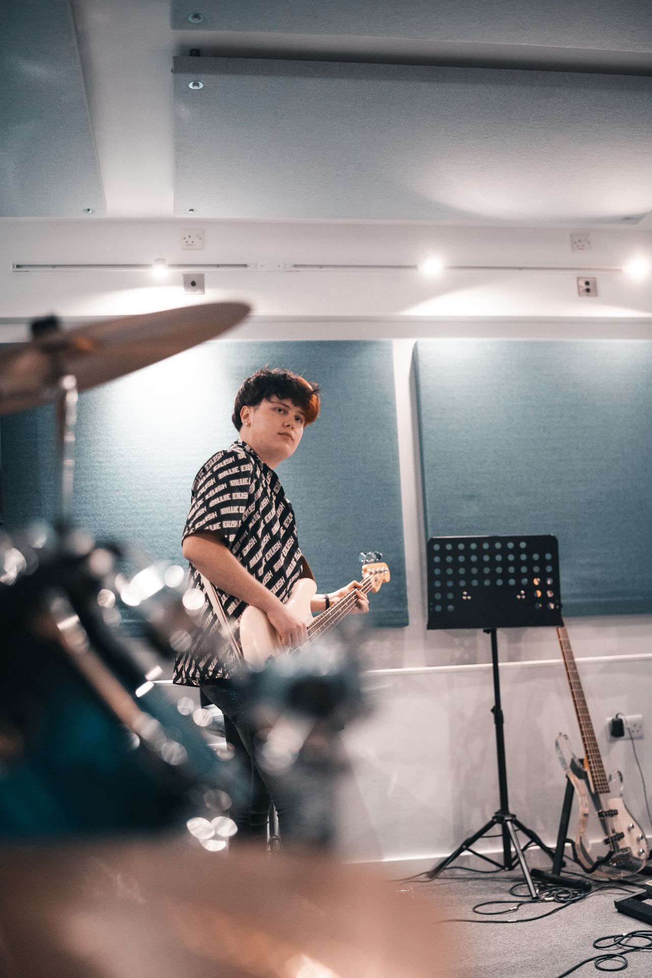 Musician recording content in a rehearsal studio